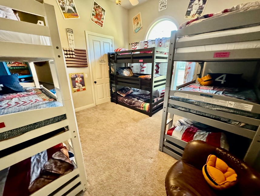 triple bunks in this baseball-themed bedroom at a luxury home for rent in Central Florida near Orlando & Disney